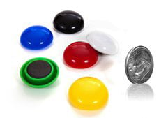 pile of button magnets next to dime for comparison