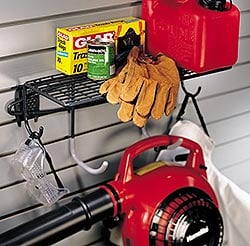 Shelf with hooks holding lawn care products