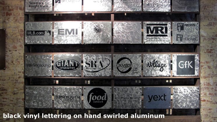black vinyl lettering on hand swirled aluminum
