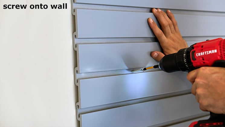 Slat wall attaches to a wall with screws