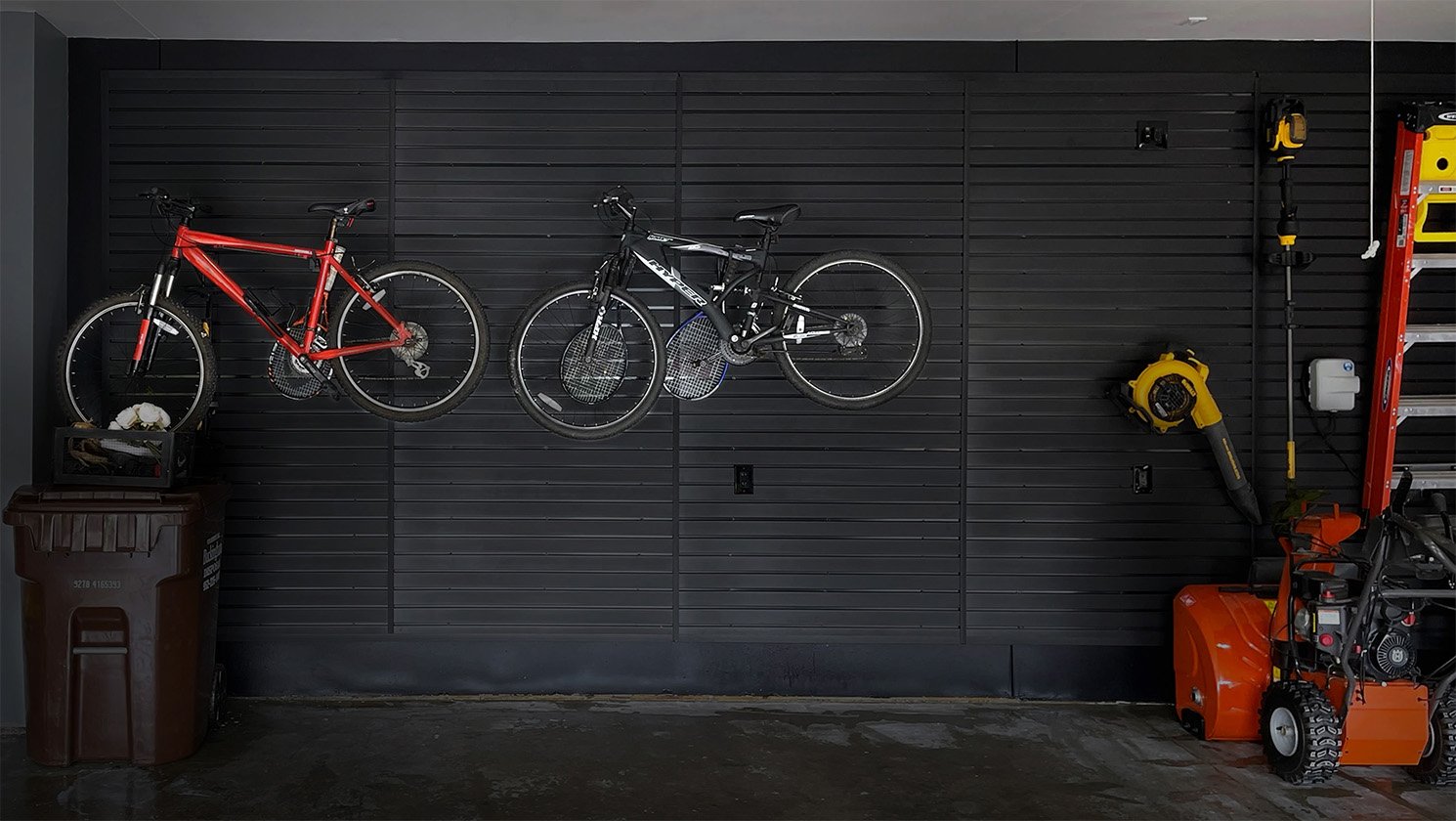 Customer photo of slat wall used to hang tools and bikes